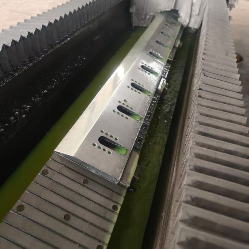 Serrated cut-off knives for paper bag making machines